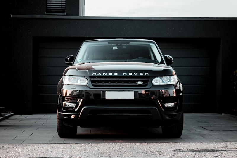Black Range Rover Sport outside a modern residence