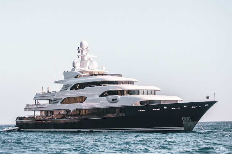 Black and white superyacht underway at sea